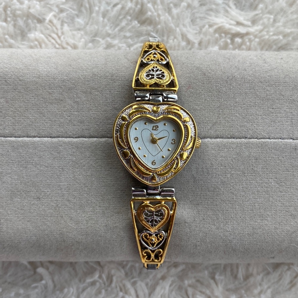 Heart shaped silver and gold colored metal watch. 💛💫